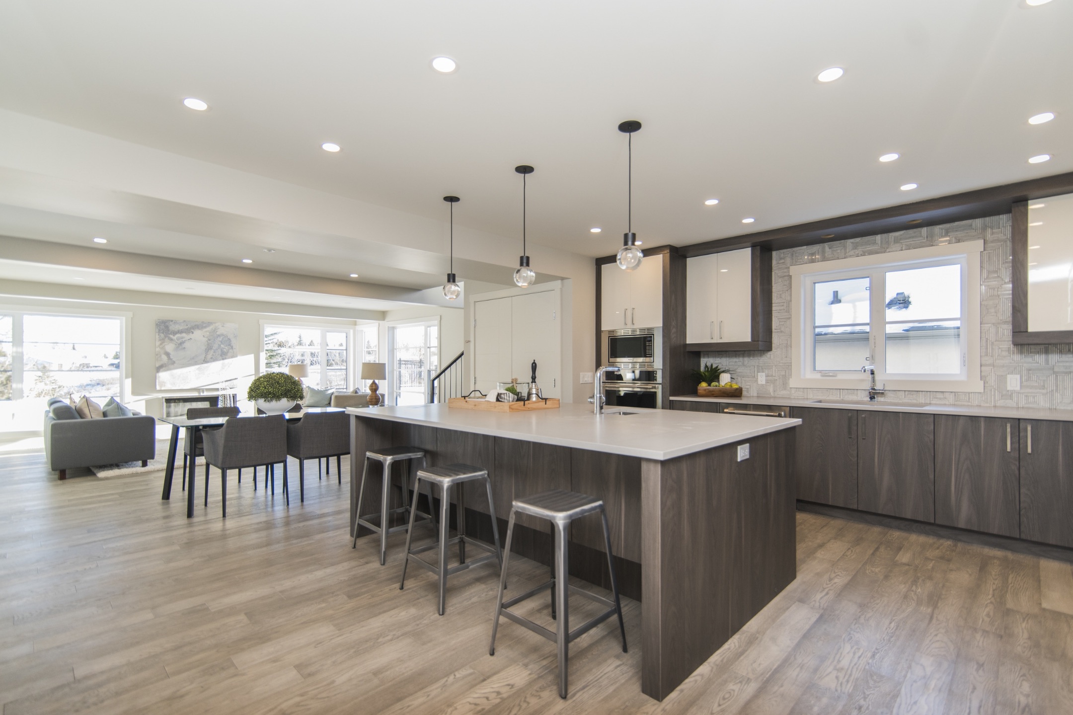 Spacious modern kitchen with sleek cabinetry and pendant lighting, exemplifying Bayside Builders Group's expertise in Bay Area home renovations and kitchen remodeling.