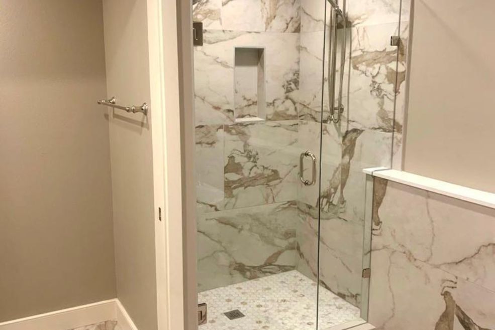 Elegant bathroom with marble-tiled shower, showcasing Bayside Builders Group's expertise in luxury bathroom renovations in the Bay Area.